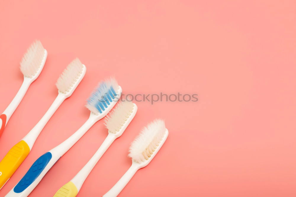 Similar – Plastic fork pattern on pink background