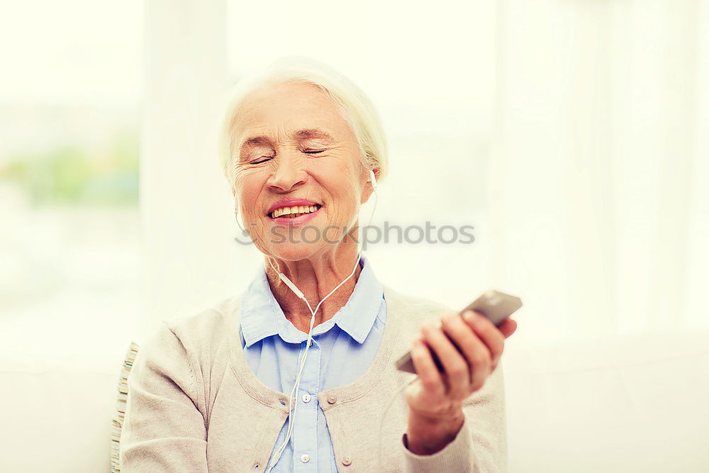 Similar – mature woman taking a selfie with smartphone