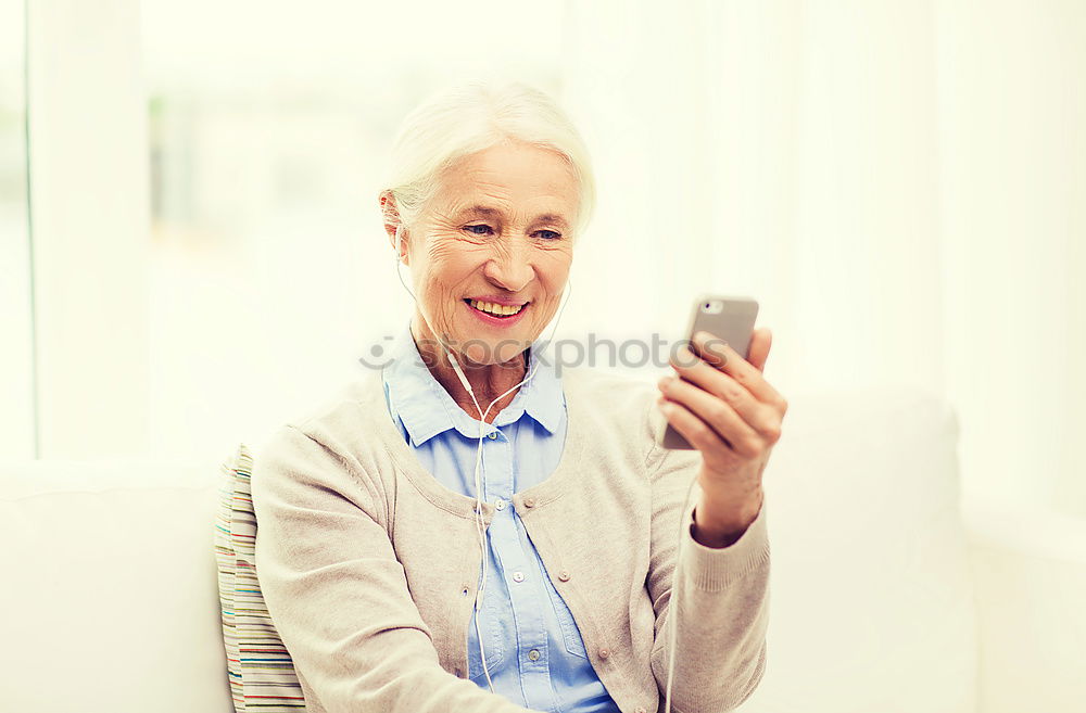 Similar – mature woman taking a selfie with smartphone