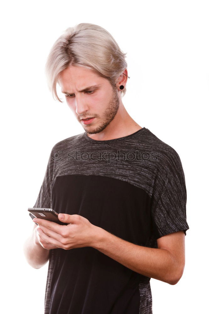Similar – Image, Stock Photo Young smiling man looking at his smartphone in the street