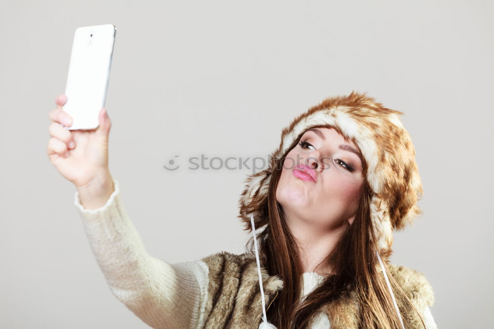 Similar – Image, Stock Photo Teen holds cell phone in front of mouth with picture of his mouth