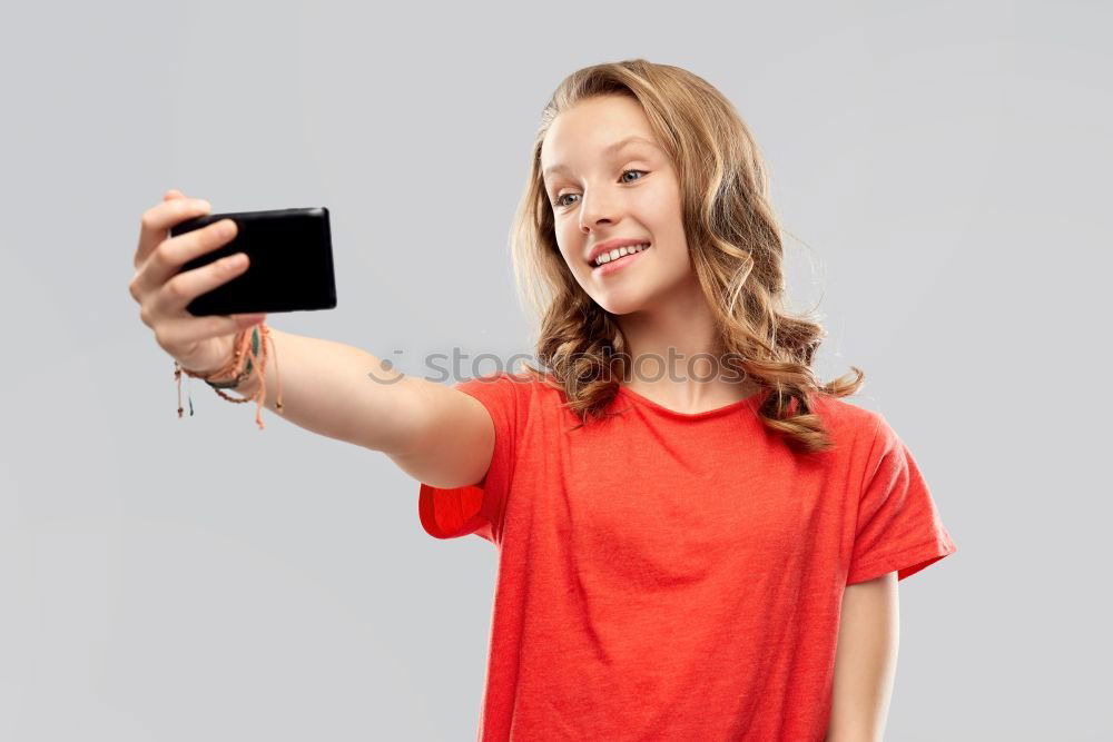 Similar – portrait of a beautiful kid using mobile phone