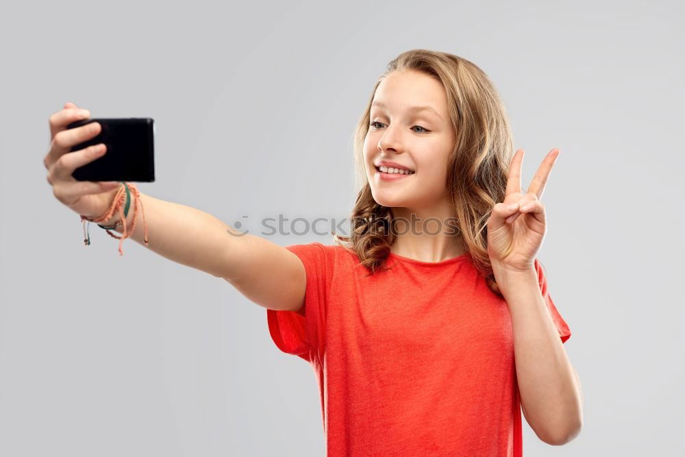 Similar – portrait of a beautiful kid using mobile phone