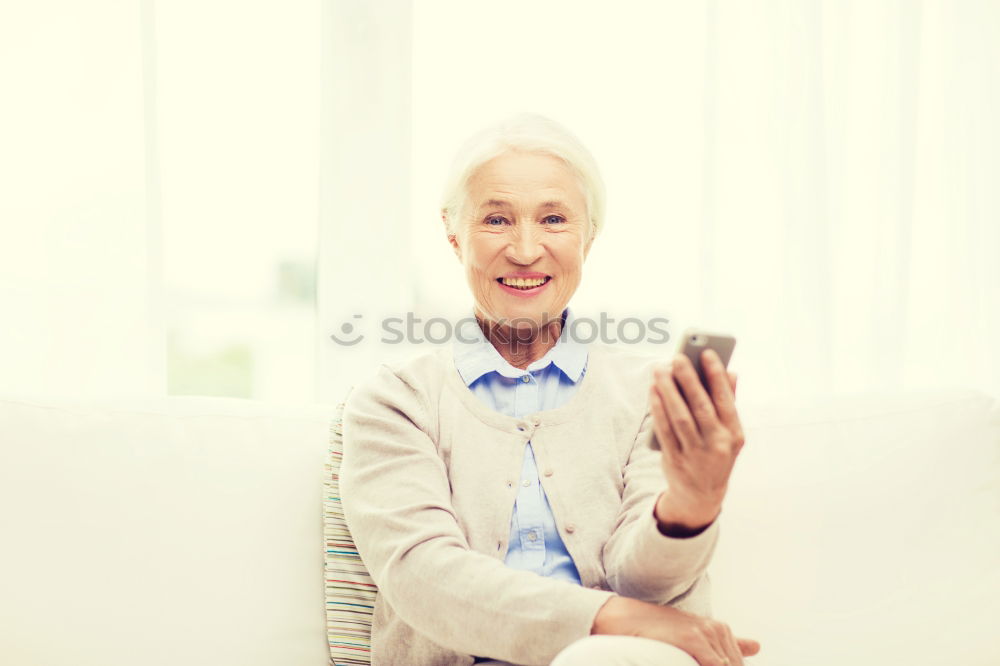 Similar – mature woman taking a selfie with smartphone