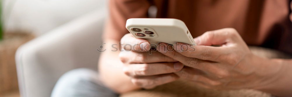 Similar – Close up of hands using smartphone