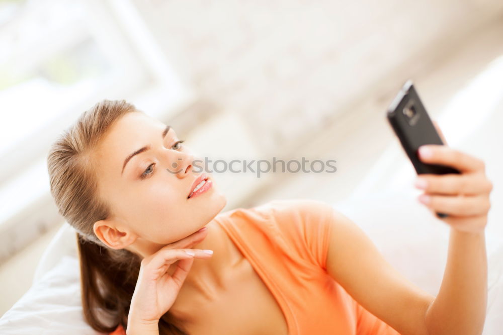 Similar – Image, Stock Photo Young woman fooling around with her smartphone