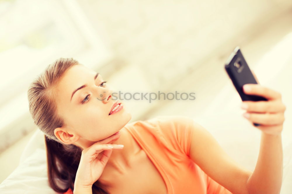 Similar – Image, Stock Photo Young woman fooling around with her smartphone