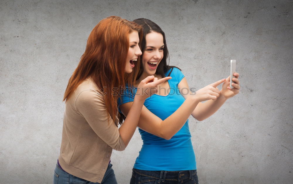 Similar – Image, Stock Photo Young women using mobile phones watching music clip, texting, messaging. Teenagers using the smartphones, sitting on sofa at home. Using technology devices. Girls wearing summer clothing