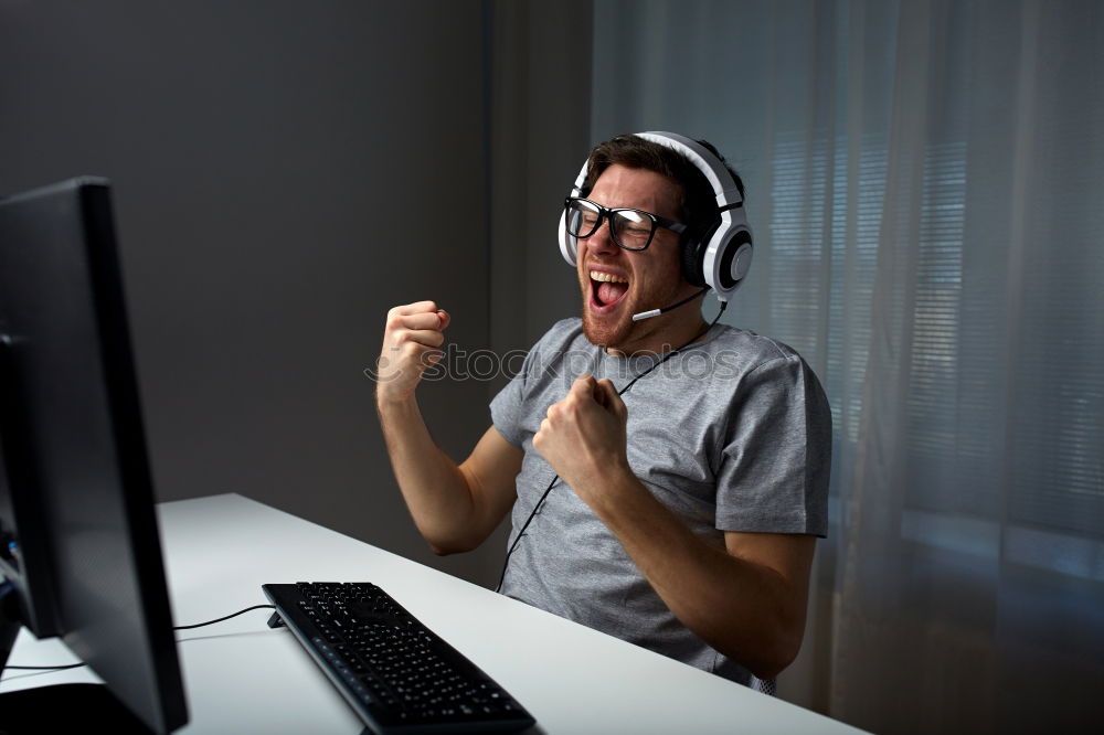 Similar – Relaxed boy holding smartphone sitting in chair at home