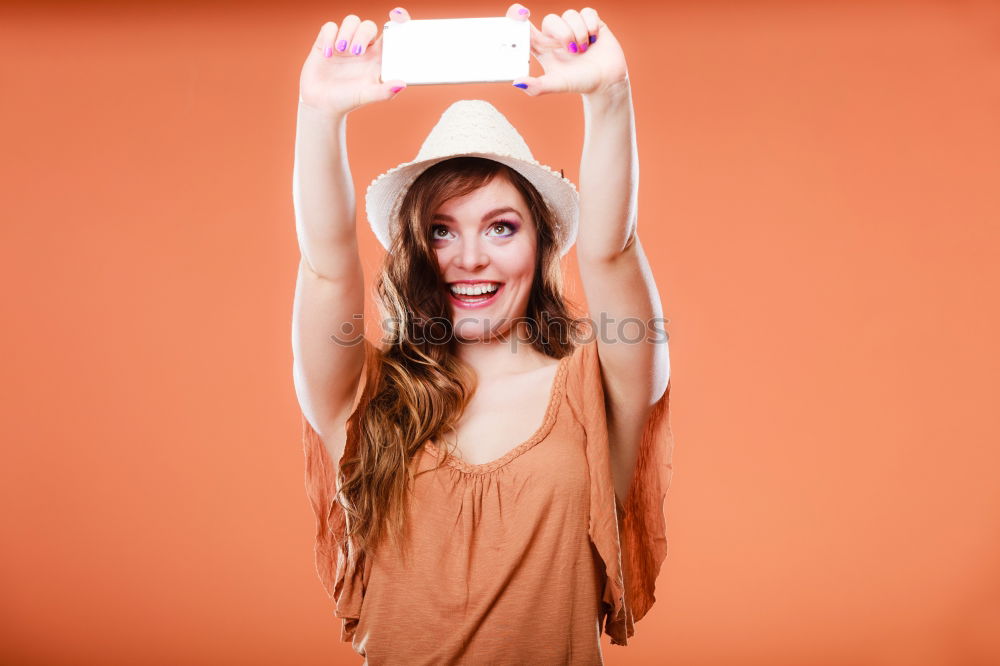 Similar – Image, Stock Photo Portrait of beautiful young woman using mobile phone in the street.