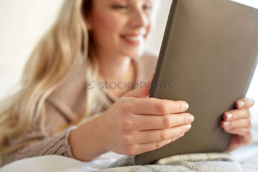 Similar – Young asian woman smiling and using tablet