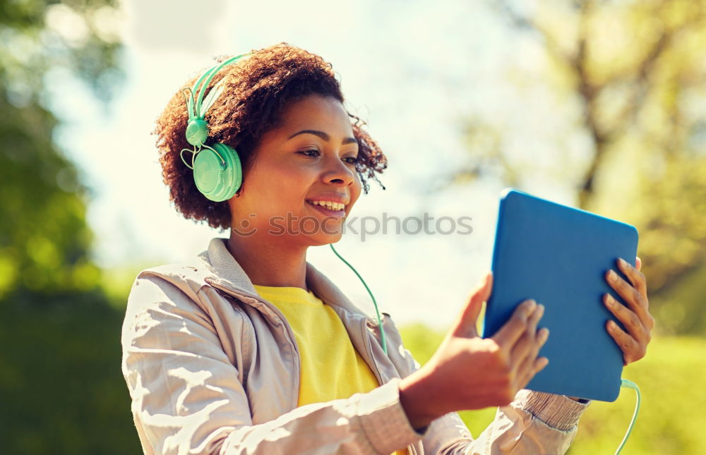 Similar – Black woman listening to the music with headphones