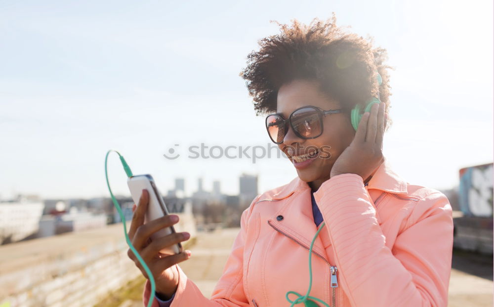 Similar – Black woman listening to the music with headphones