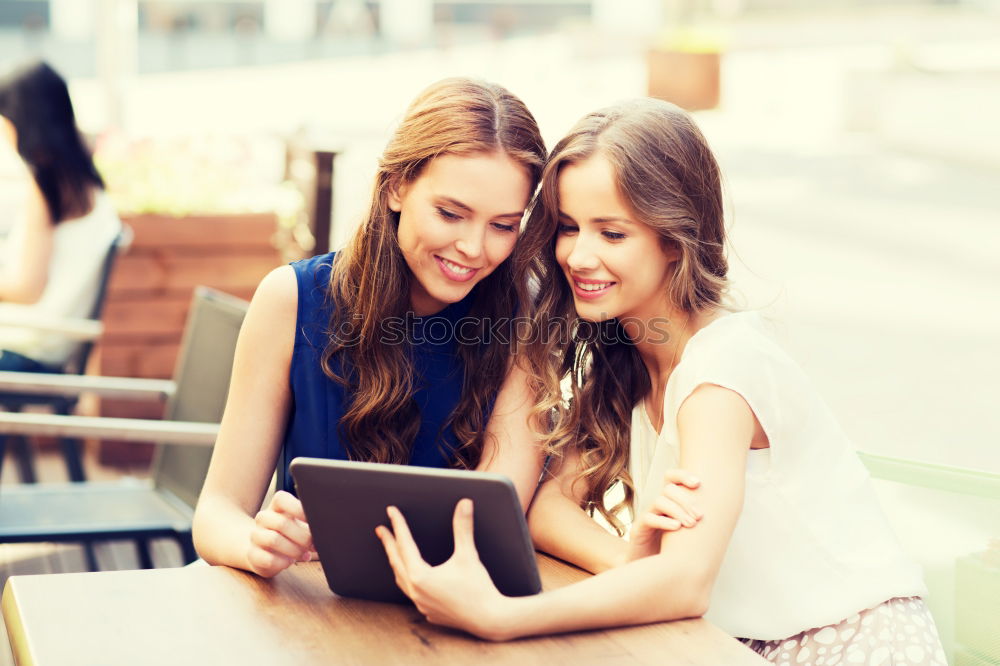 Similar – Image, Stock Photo Two male teenagers surfing the internet on tablet computer while sitting in cafe. One young man pointing at screen