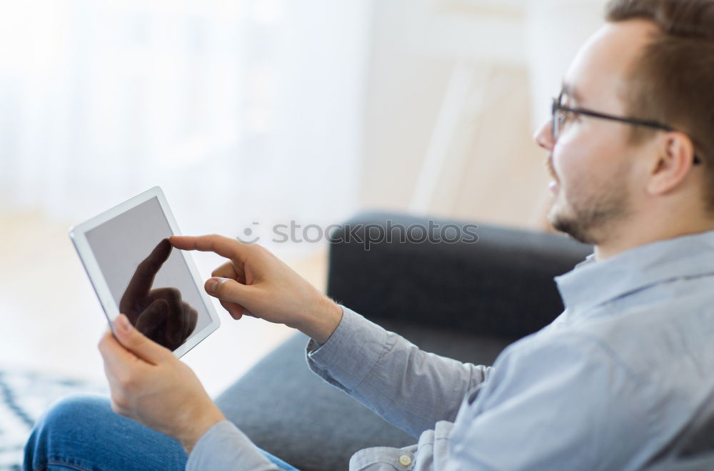 Similar – Two businessman meeting and using smartphone with laptop at outdoor cafe