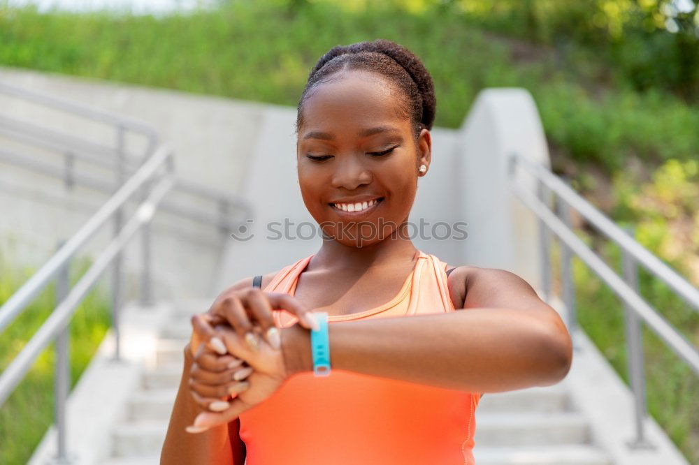 Similar – Black woman using smartwatch touching touchscreen