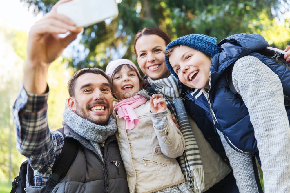 Similar – Young happy couple using smart phone sitting in the park