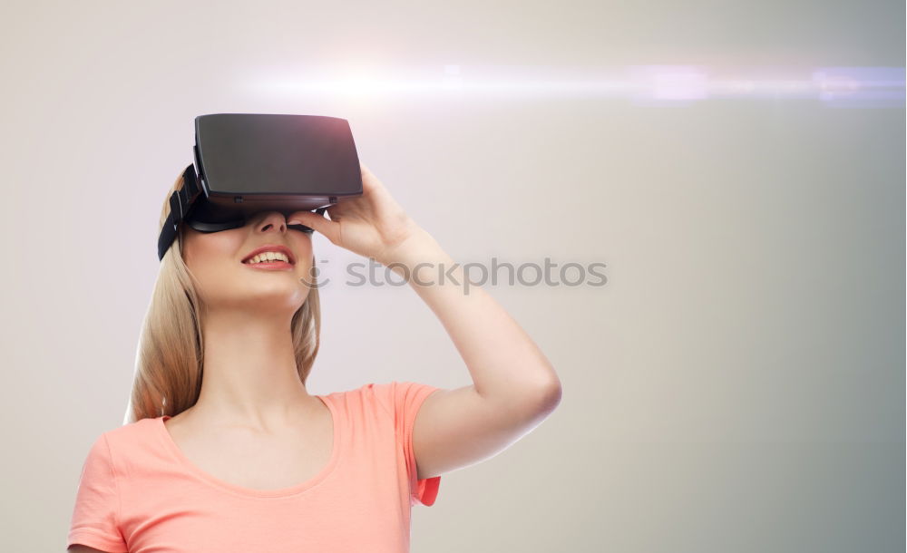 Similar – Image, Stock Photo Boy with virtual reality glasses on colorful background. Future technology, VR concept