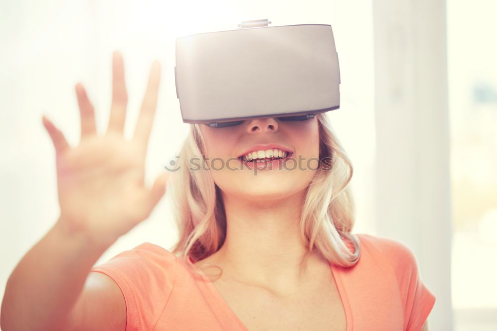 Similar – Image, Stock Photo Boy with virtual reality glasses on colorful background. Future technology, VR concept