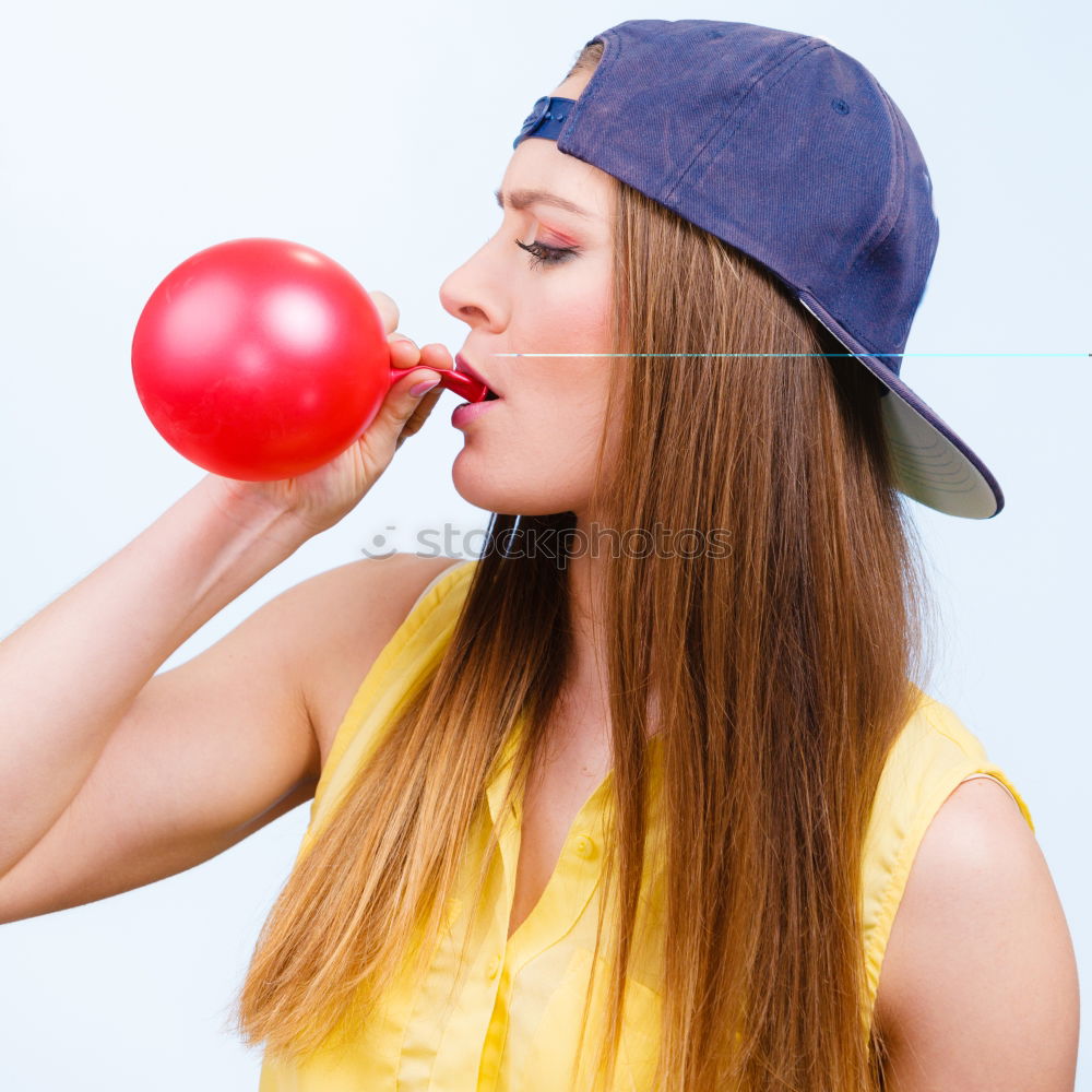 Similar – Thoughtful, dreamy, sweet girl with a white balloon in her hand in the garden, looks into the camera. Dear birthday girl outside in the nature is happy about a gift balloon for her party, holds it tight and puts it in her mouth.