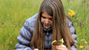 Similar – Young FRau sits laughing on the floor