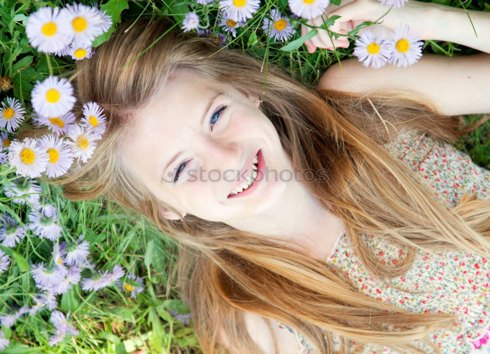 Similar – romantic portrait of happy child girl picking bouquet of beautiful blue delphinium flowers from summer garden