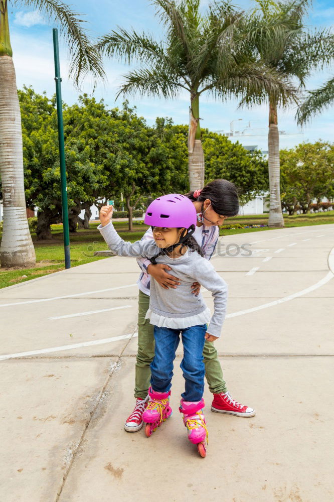 Similar – Two kids riding together wtih a skate board