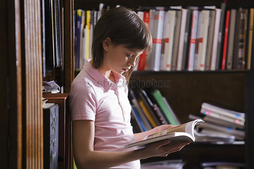 Similar – Student girl in a library