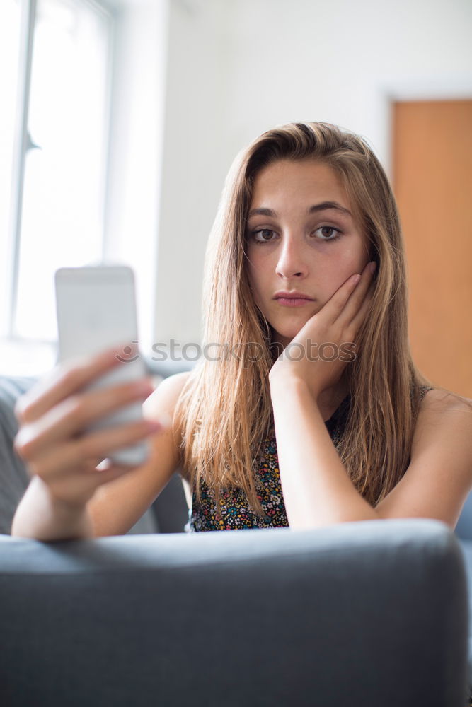 Similar – Image, Stock Photo Happy woman using smartphone at a wooden wall