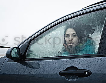 Similar – young woman in a car