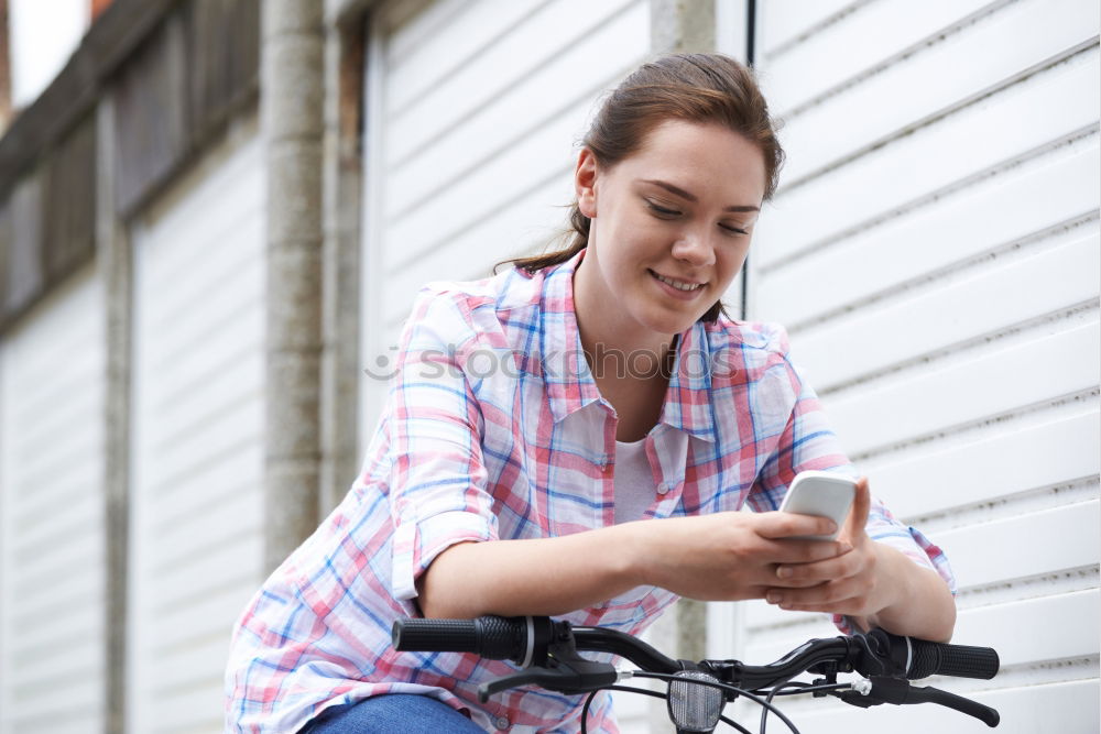 Similar – Image, Stock Photo Women with bikes browsing smartphone