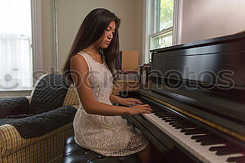 Similar – Image, Stock Photo young woman holding playing piano at home