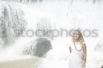 Similar – Woman with sunglasses plays with water