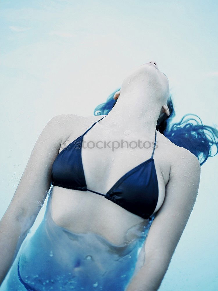 Similar – Young woman in a pool enjoying the water