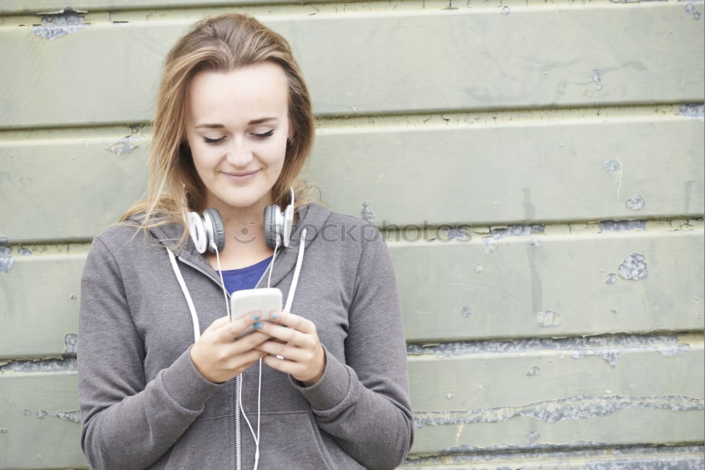 Similar – Image, Stock Photo Young woman with mobile phone walking a city street