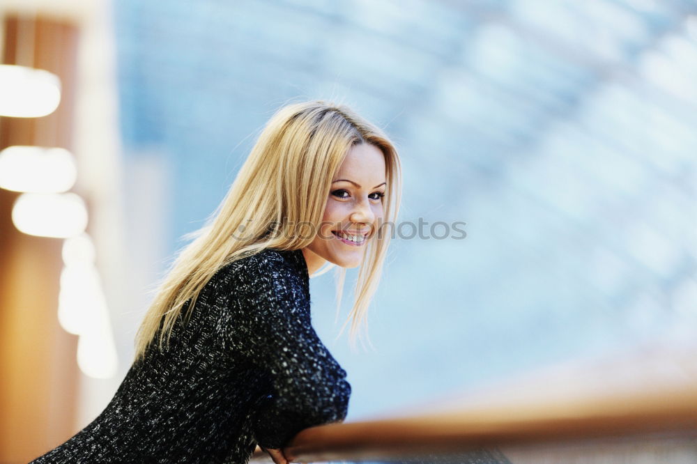 Similar – Smiling young woman in urban background.