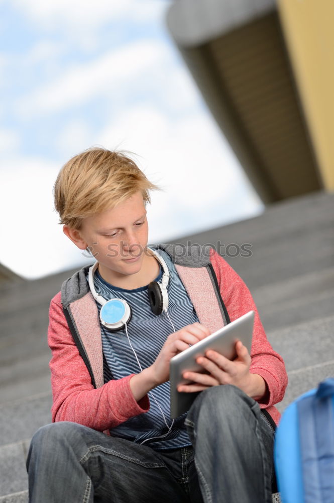 Similar – Image, Stock Photo young boy looking at tablet pc computer with frustrated look on his face