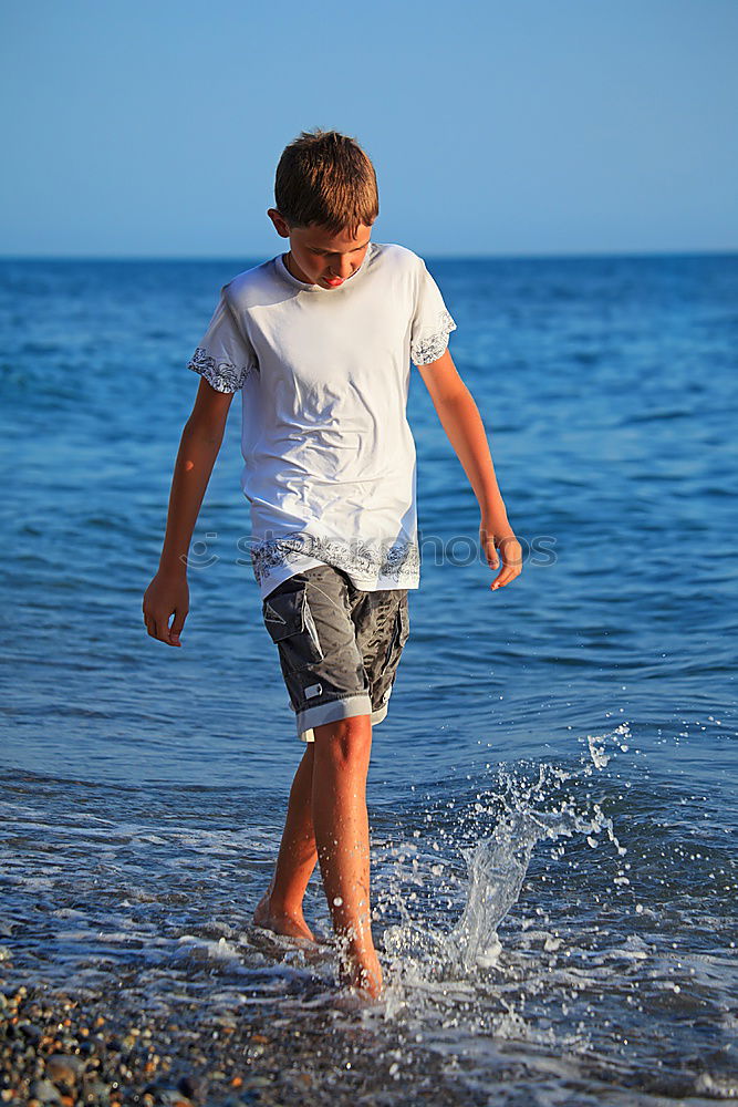 Similar – Image, Stock Photo Happy children playing on the beach at the day time. Two Kids having fun outdoors. Concept of summer vacation and friendly family.