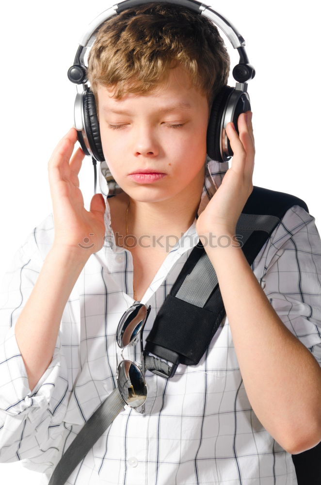 Similar – Child with headphones, listening to music