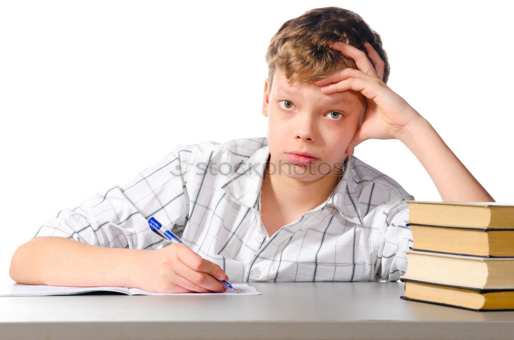 Similar – Boring schoolboy studying