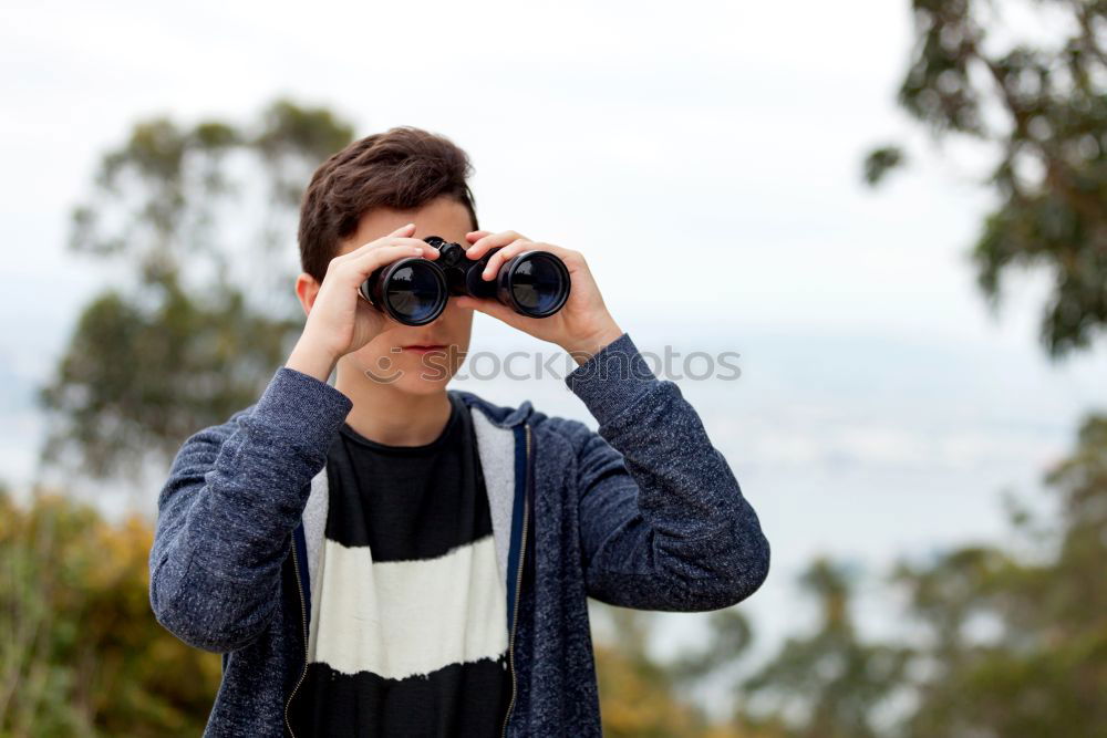 Similar – Young modern man sitting on halfpipe taking picture with Camera