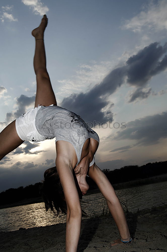 Similar – Image, Stock Photo Athletic man balancing on gymnastic rings