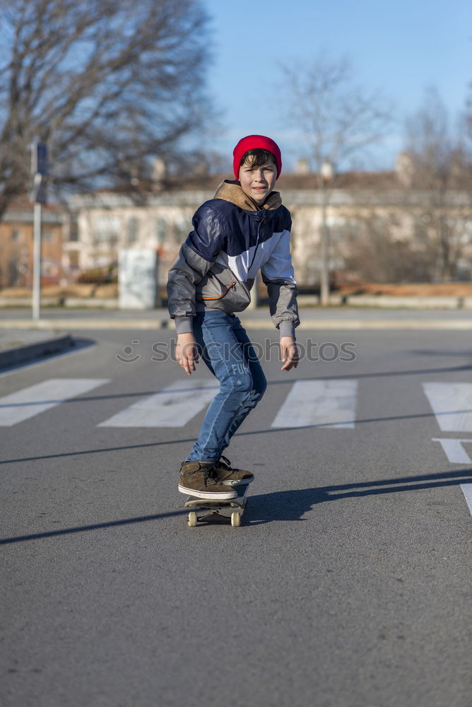 Similar – Portrait of young skateboarder man with bad boy face in the middle of the street.