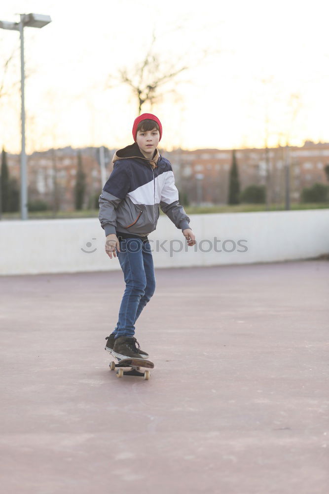 Similar – Kid skateboarder doing a skateboard trick.