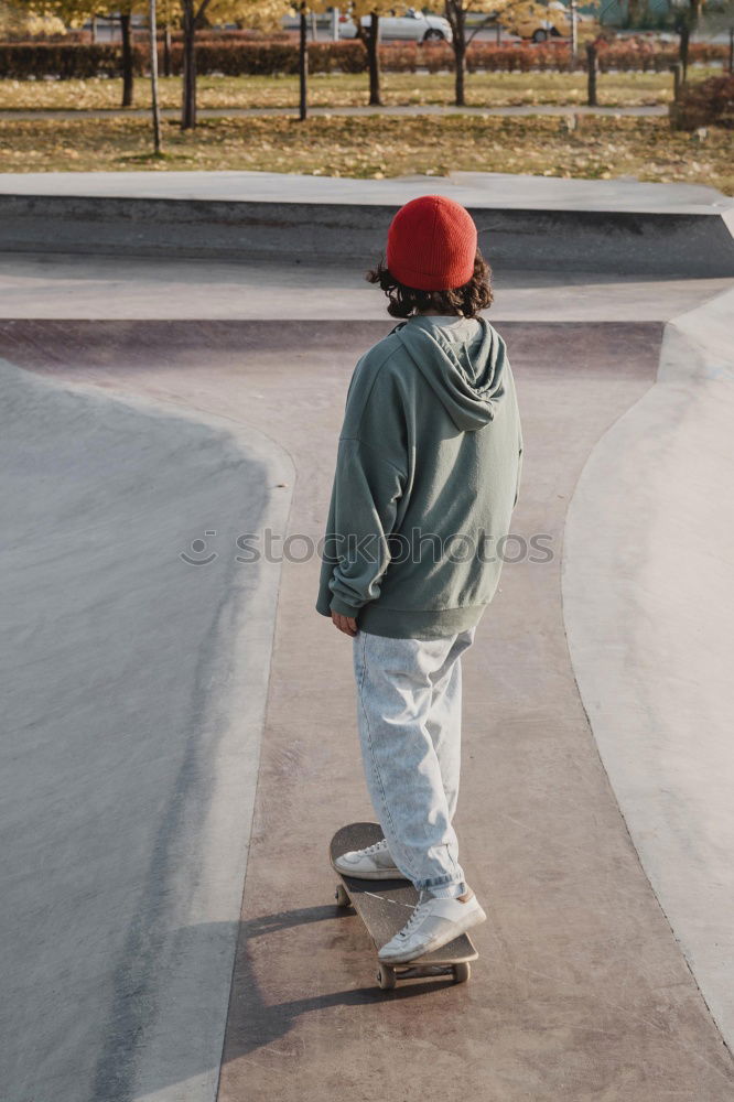 Kid skateboarder doing a skateboard trick.