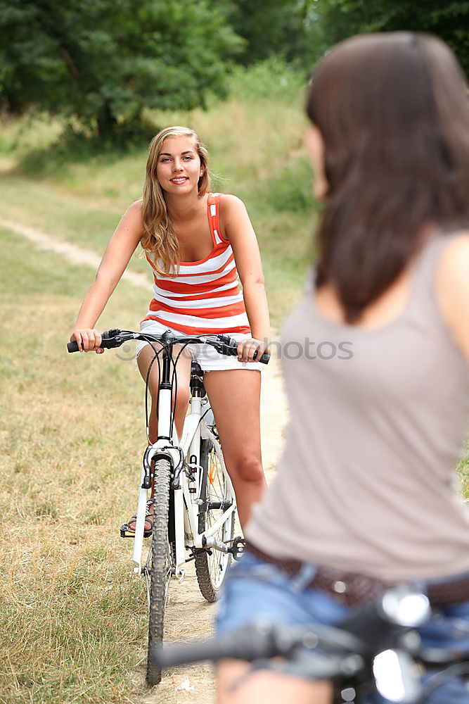 Similar – Image, Stock Photo women using smartphone on bicycles