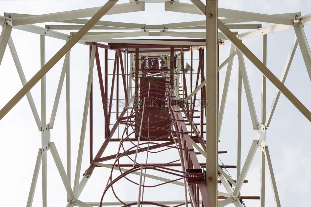 Similar – Power pole from the inside from the frog’s perspective in front of a blue sky