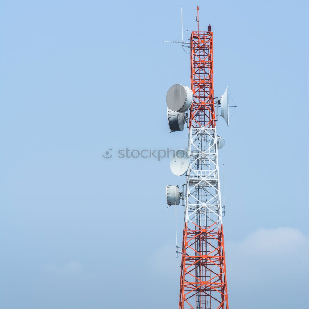 Similar – Telecommunication tower with cloudy sky background. Antenna on blue sky. Radio and satellite pole. Communication technology. Telecommunication industry. Mobile or telecom 5g network. Technology