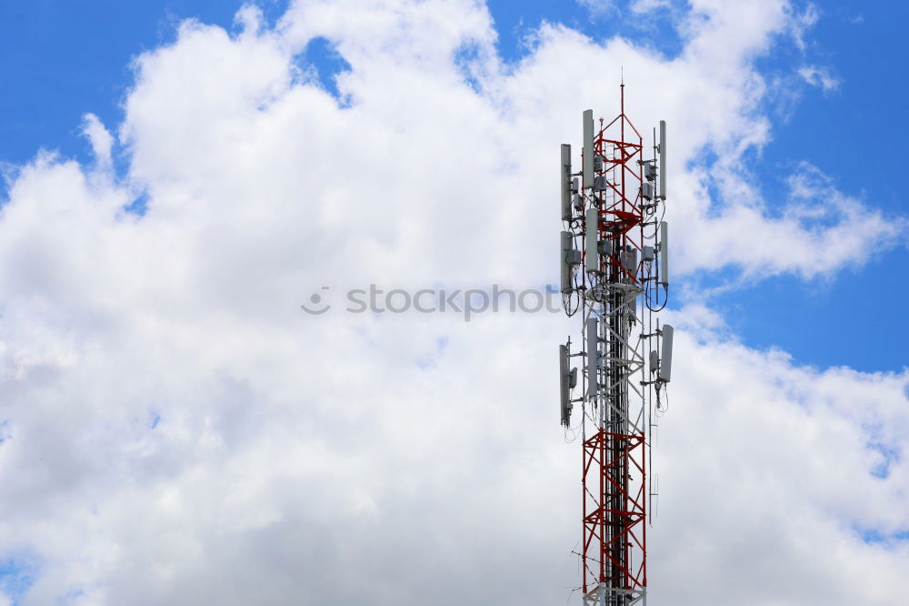 Similar – Telecommunication tower with cloudy sky background. Antenna on blue sky. Radio and satellite pole. Communication technology. Telecommunication industry. Mobile or telecom 5g network. Technology