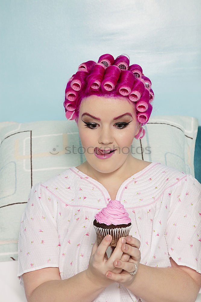 Similar – Young woman with pink hair is holding colorful lollipops